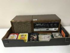 A Stereo 8 radio mobile system and eleven 8 track cartridges