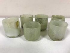 A set of six early 20th century jade rice wine cups