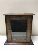 An Edwardian oak smoker's cabinet