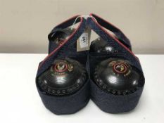 A set of four Thomas Taylor (bowls) Ltd competition bowls in carry sling