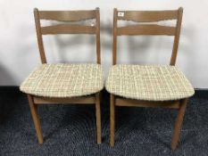 A set of four late twentieth century teak dining chairs