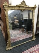 A late nineteenth century gilt framed overmantel mirror
