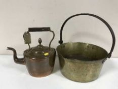 A vintage brass jam pan together with an antique copper kettle