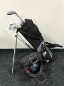 A Dunlop golf bag containing part set of clubs together with a bowling ball in bag