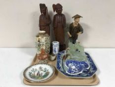 A tray of carved eastern figures, blue and white 19th century plate, oriental vases, lidded dish,
