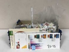 A crate of loose stamps and covers