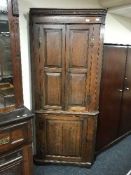 A Victorian oak double door corner cabinet