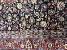 A fringed Iranian Mahshad carpet on blue ground