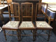 A set of three Edwardian mahogany rail backed bedroom chairs