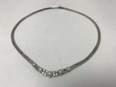 18 ct white gold necklace set with pearls and diamonds about .9ct. 28.