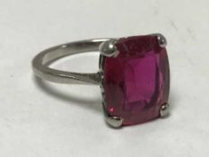 Antique 18ct white gold ring set with large red precious stone
