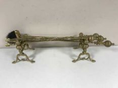 A brass companion set and a pair of fire dogs