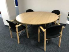 A circular twin section office boardroom table together with four armchairs and two-tier coffee