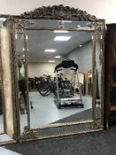 An ornate gilt framed Victorian style bevelled mirror