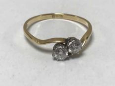 18ct two stone diamond twist ring (old cut) - approximately .