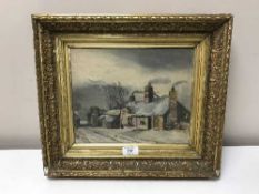 An early twentieth century gilt framed oil - Figures by a cottage in a winter landscape