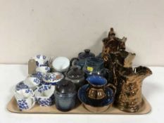 A tray of antique blue and white tea for two, three graduated copper lustre jugs,