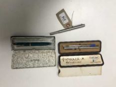 A Parker '45' Delux fountain pen together with Parker 25 stainless steel pen set and one further