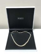 Fine quality strap of graduated pearls on a white gold diamond clasp