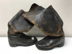 A pair of vintage leather heavy duty boots
