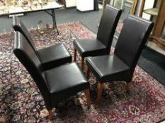 Six high backed leather chairs
