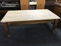 A pine topped farmhouse dining table on antique mahogany base