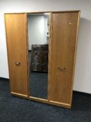 A teak G-plan triple door wardrobe