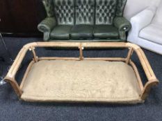 An antique pine settee frame