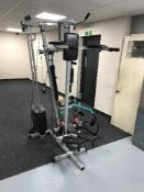A pro-power three station home multi gym together with ab roller