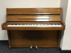 A walnut cased overstrung piano by Danemann
