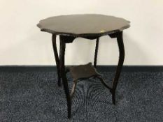 An Edwardian shaped oak occasional table