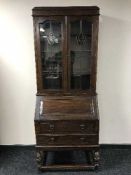An early twentieth century oak leaded glass door bureau bookcase