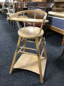 A mid twentieth century beech folding high chair