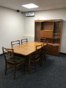 An eight piece late twentieth century teak dining room suite comprising of display cabinet,