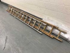A set of aluminium ladders and set of wooden extension ladders