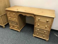 A Victorian style knee hole pine desk
