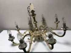 A heavy brass eight branch chandelier