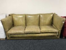 A tan leather three seater drop end settee (for restoration)