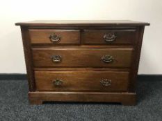 An Edwardian mahogany four drawer chest