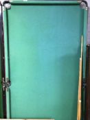 A 6' folding snooker table with cues and accessories