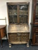 An oak bureau bookcase