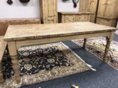 A reclaimed pine farmhouse kitchen table,