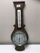 An inlaid mahogany barometer with silvered dial