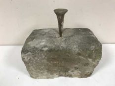 A boot scraper on sandstone base