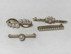 Four gold and pearl brooches.