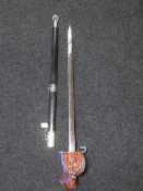 A decorative basket handled sword in scabbard