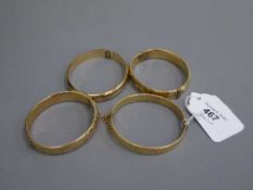 Four vintage gold plated bangles (4)