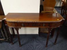 A late Victorian mahogany shaped front side table fitted a drawer