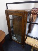 An oak leaded door display cabinet