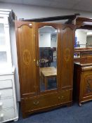 A Victorian mahogany mirror door wardrobe